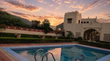 Outdoor pool, open 6:30 AM to 8:00 PM, pool loungers