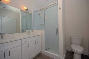 Combined shower/tub, hair dryer, towels, soap