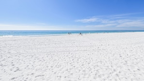 A wide sandy beach with a clear blue sky and calm sea. - Great beachfront condo!  Best View in Destin! Jade East Towers unit 920! (Destin)