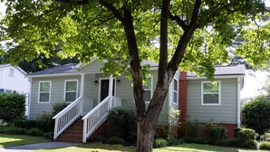 A two-story house with a front porch, a staircase, and a tree in front. - Convenient to everything!! (Cartersville)