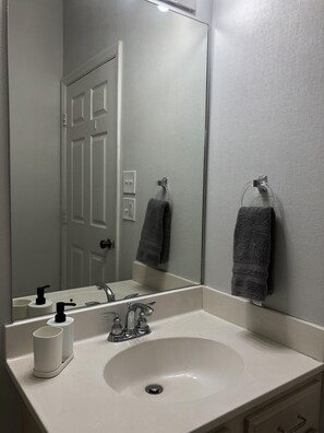 Combined shower/tub, hair dryer, towels, soap