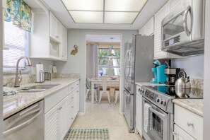 Fridge, microwave, oven, stovetop - Updated ground-level Villa, Pet Friendly and so close to the beach! Great Rates! (Holmes Beach)