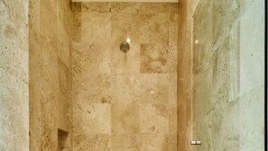A small, enclosed shower area with tiled walls and floor. - Azul Bucerias 3 Brdm Beachfront,  paradise to enjoy (Bucerías)
