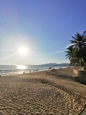 On the beach, sun loungers, beach towels
