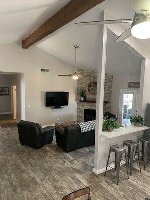 Spacious vaulted ceiling with new tile throughout