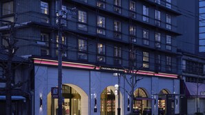 A multi-story hotel with a modern facade, large arched entrances, and a prominent signage for "Fauchon L'Hôtel Kyoto". - Fauchon Hotel Kyoto (Kyoto)
