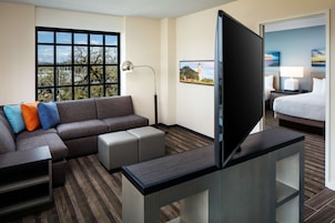 Hypo-allergenic bedding, desk, laptop workspace, blackout curtains