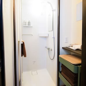 Shower, free toiletries, slippers, towels