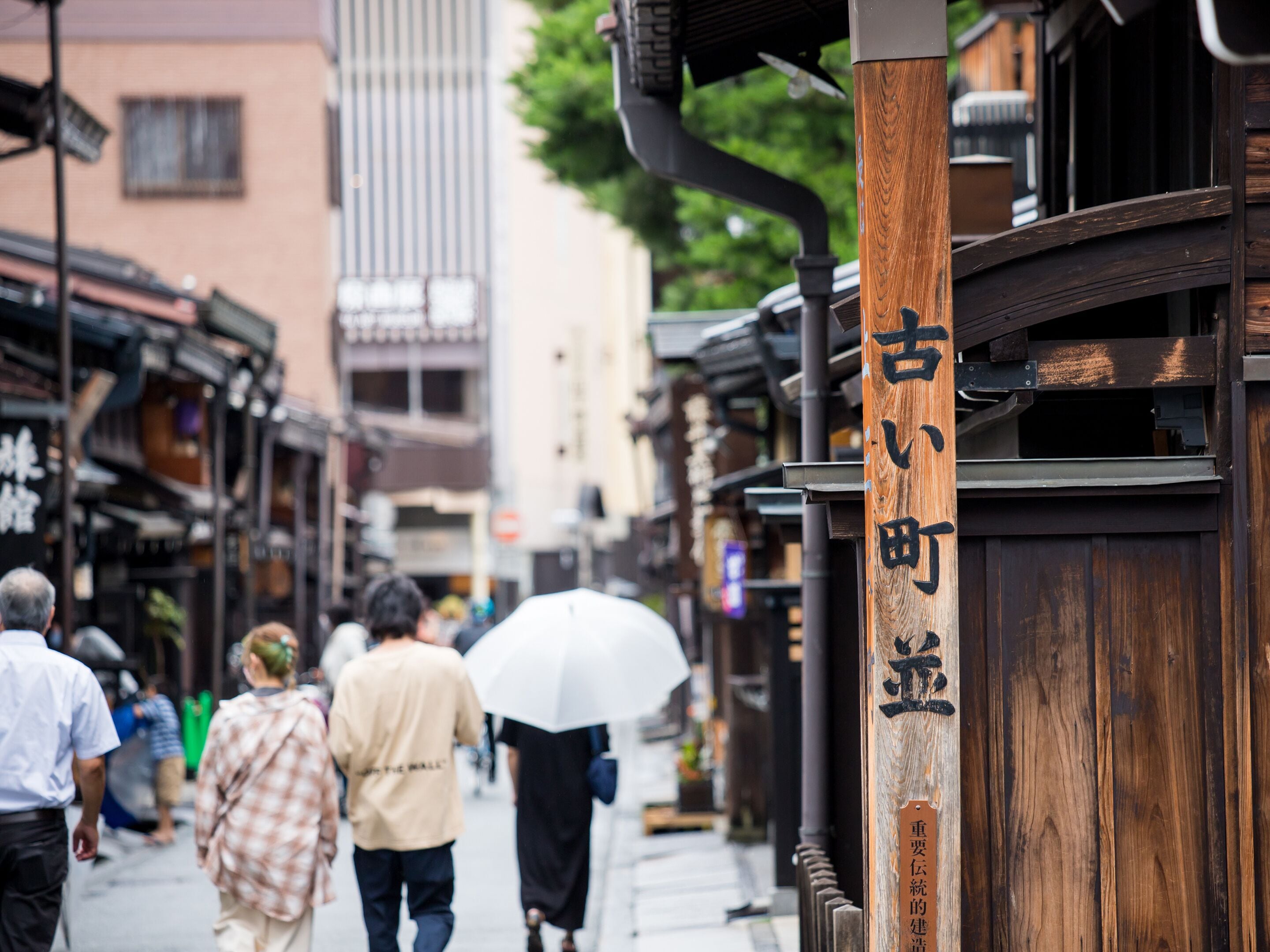A traditional wooden building with signage indicating a historical site.