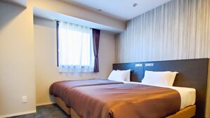 A hotel room with a large bed, a window with curtains, and a headboard with controls. - HOTEL LiVEMAX Tachikawa Ekimae (Tachikawa)