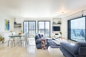 Apartment, 2 Bedrooms, Balcony | Living area | 40-inch flat-screen TV with cable channels, LCD TV - Deluxe 2 Bedroom Apartment in Herzylia (Herzliya)