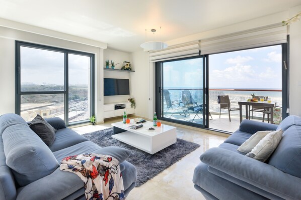 Apartment, 2 Bedrooms, Balcony | Living room | 40-inch flat-screen TV with cable channels, LCD TV - Deluxe 2 Bedroom Apartment in Herzylia (Herzliya)