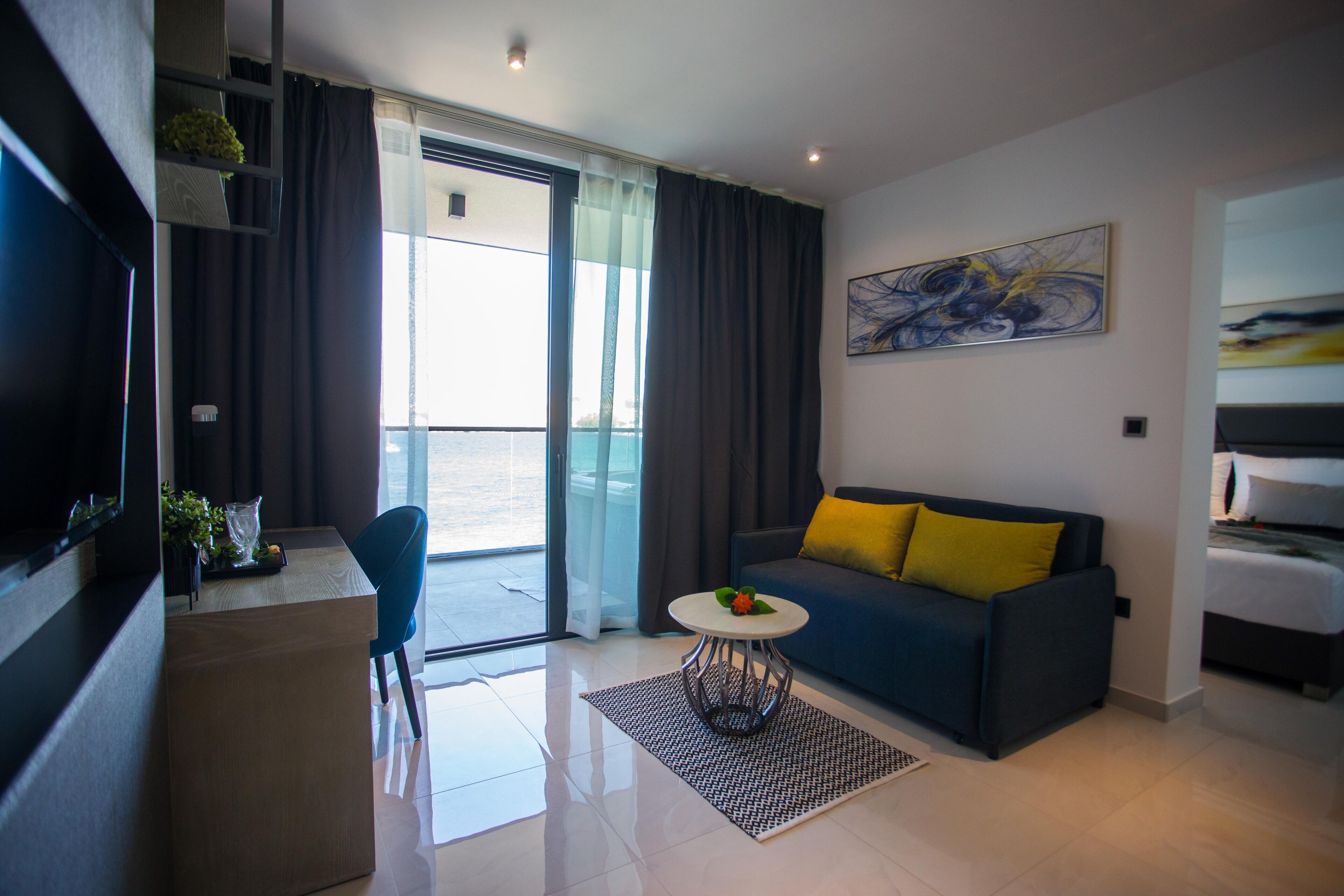 presidential suite, hot tub, sea view | living area | 115-cm lcd tv with satellite channels, tv