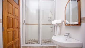 Bathtub, slippers, bidet, towels