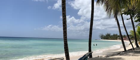 On the beach, sun-loungers, beach towels