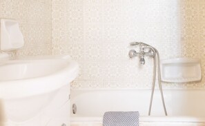Bathtub, hair dryer, towels