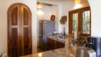Fridge, microwave, stovetop, coffee/tea maker