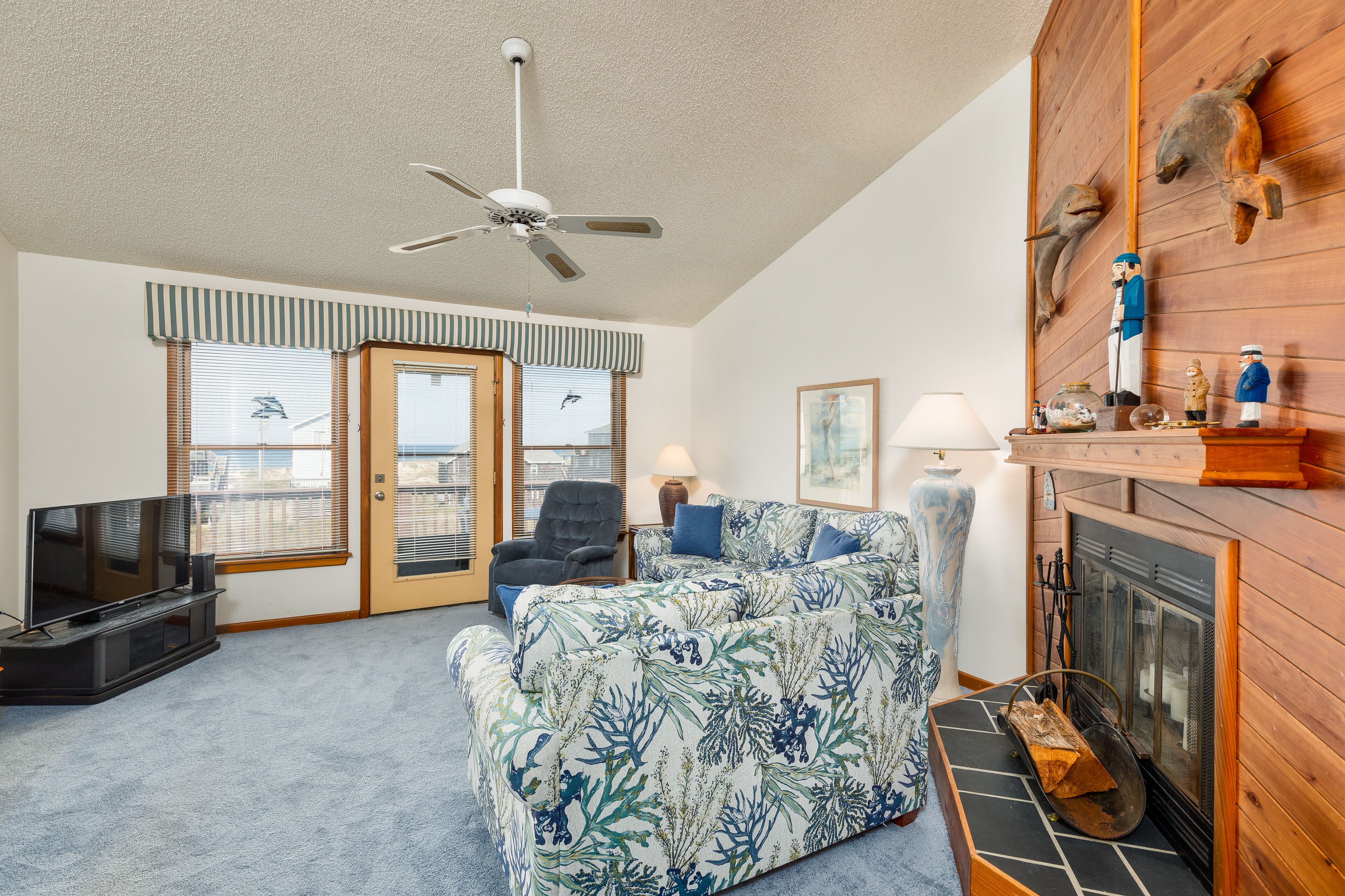 Sea Dunes condo with community pool and tennis, beach access, porch swing, baby gate, and WiFi