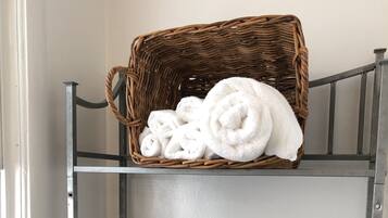 Combined shower/tub, hair dryer, towels, soap