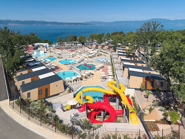 Seasonal outdoor pool, open 10:00 AM to 7:00 PM, pool umbrellas
