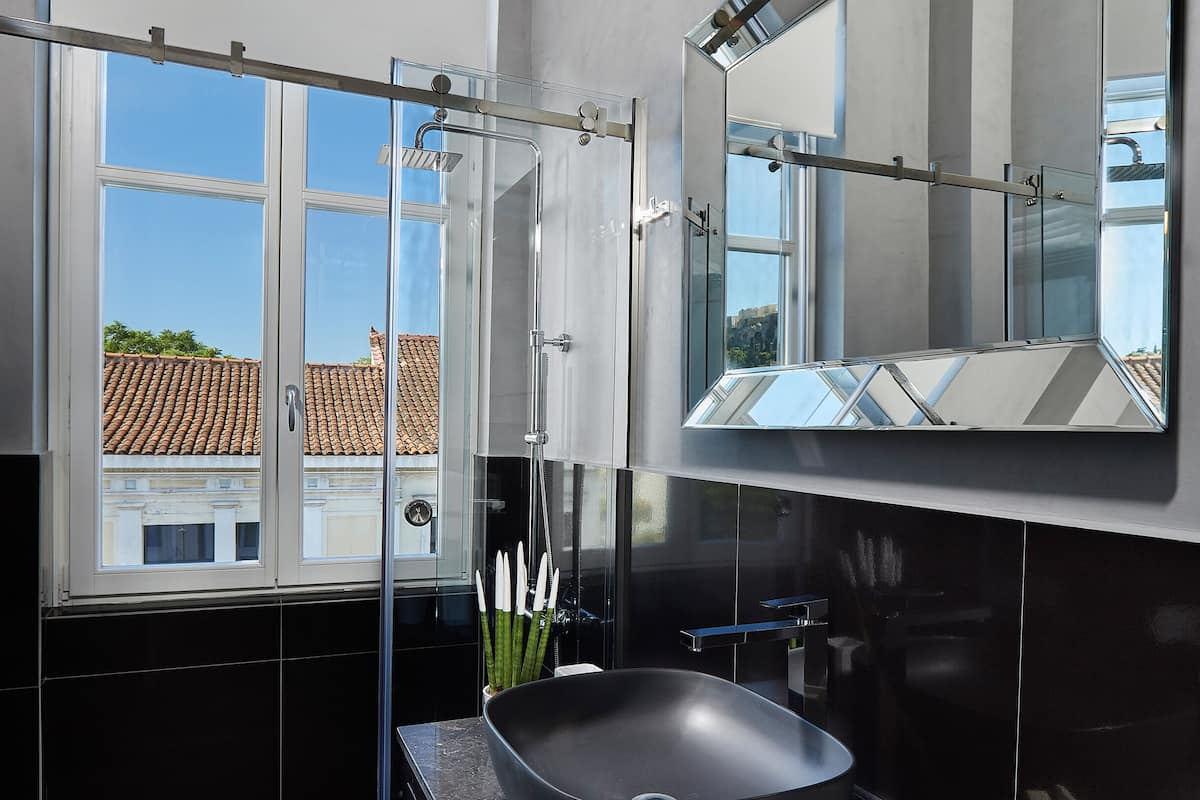 shower, designer toiletries, hair dryer, slippers