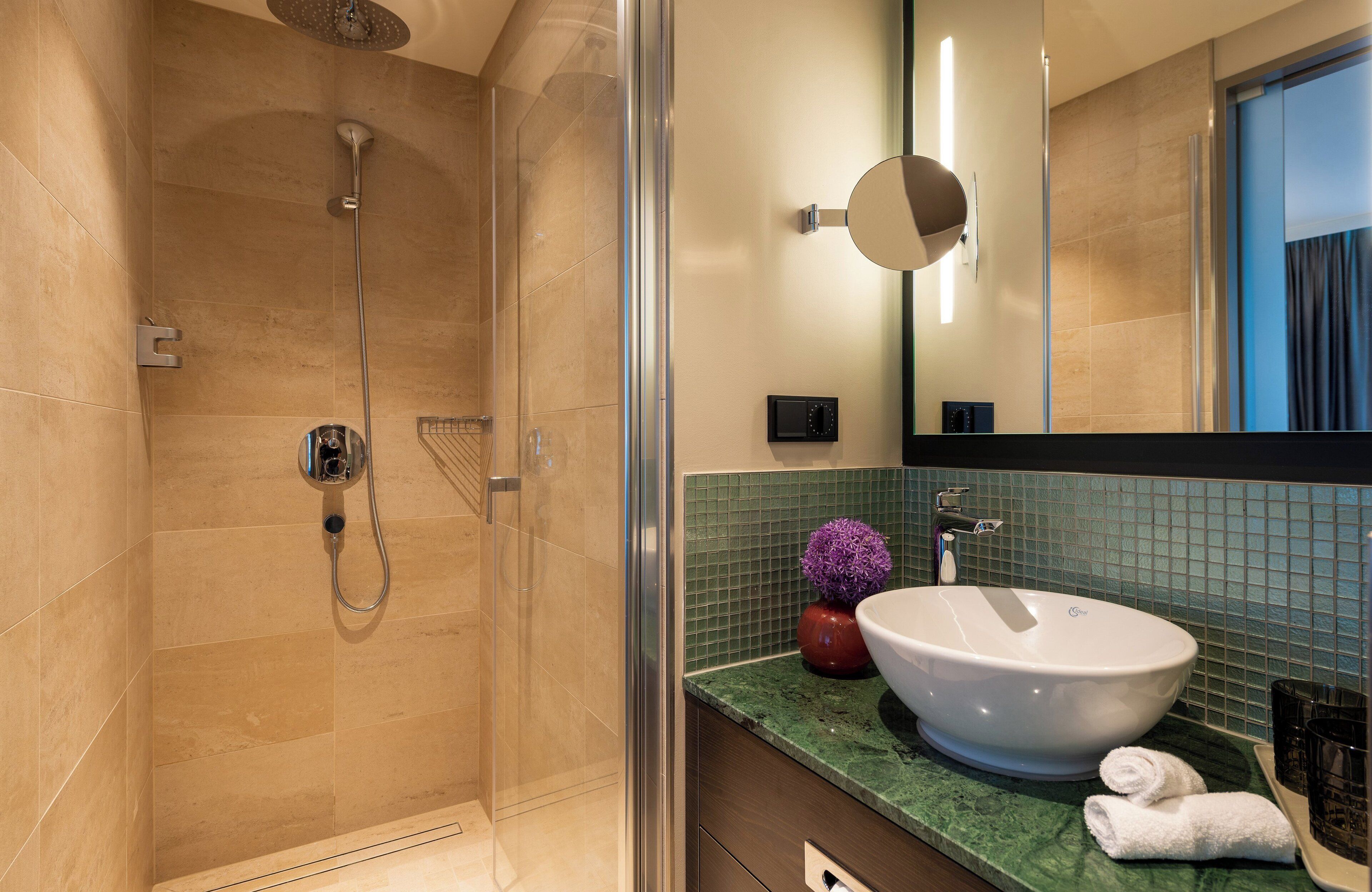 shower, rainfall showerhead, hair dryer, towels