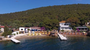 Enjoy breathtaking views of the marina and surrounding hills from this picturesque waterfront location.