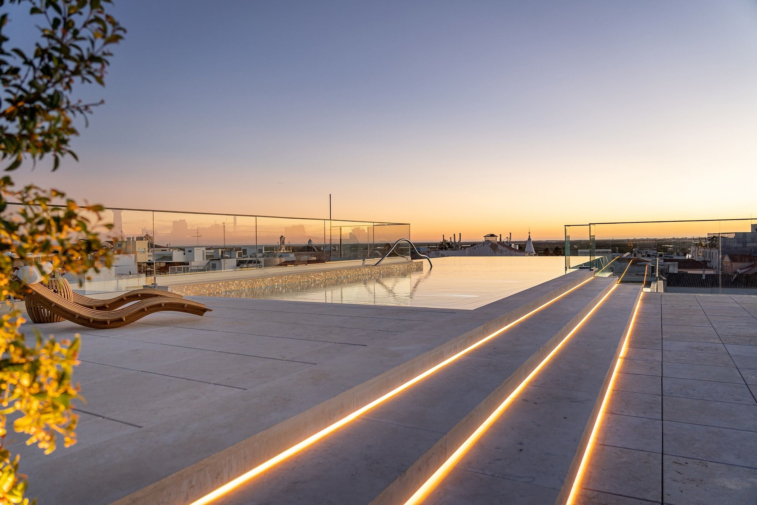 indoor pool, outdoor pool, pool umbrellas, pool loungers