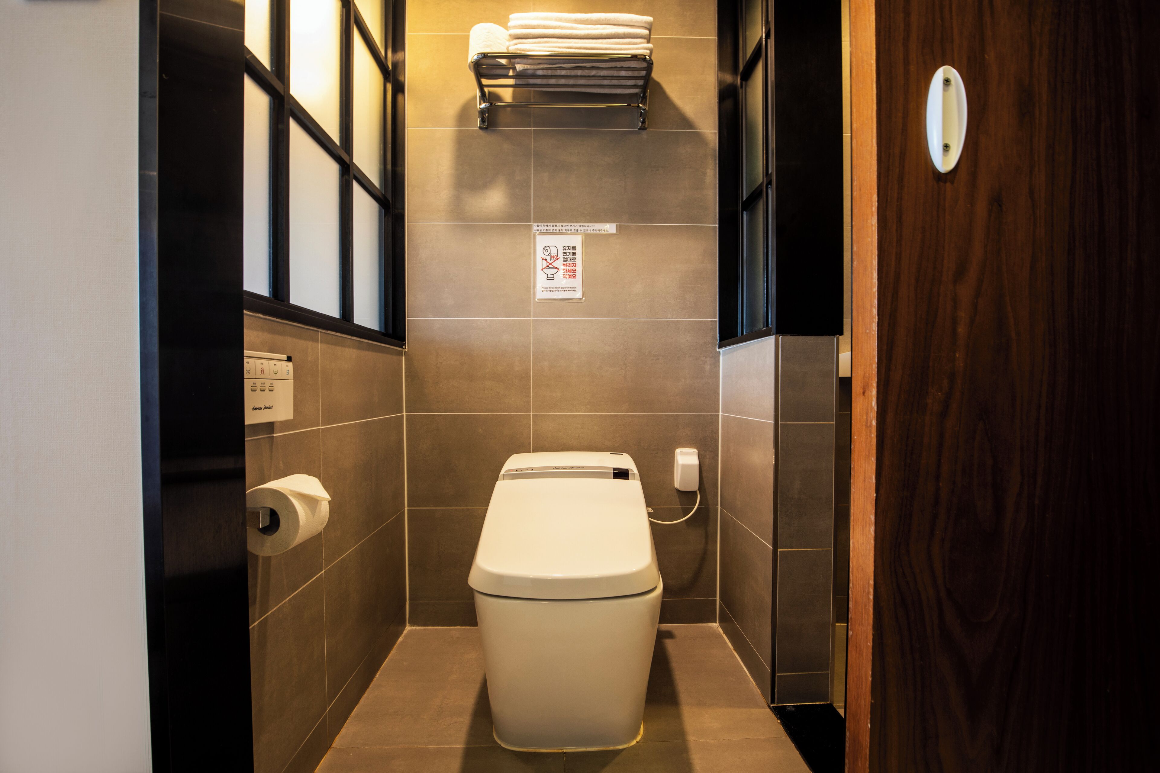 hair dryer, slippers, bidet, towels