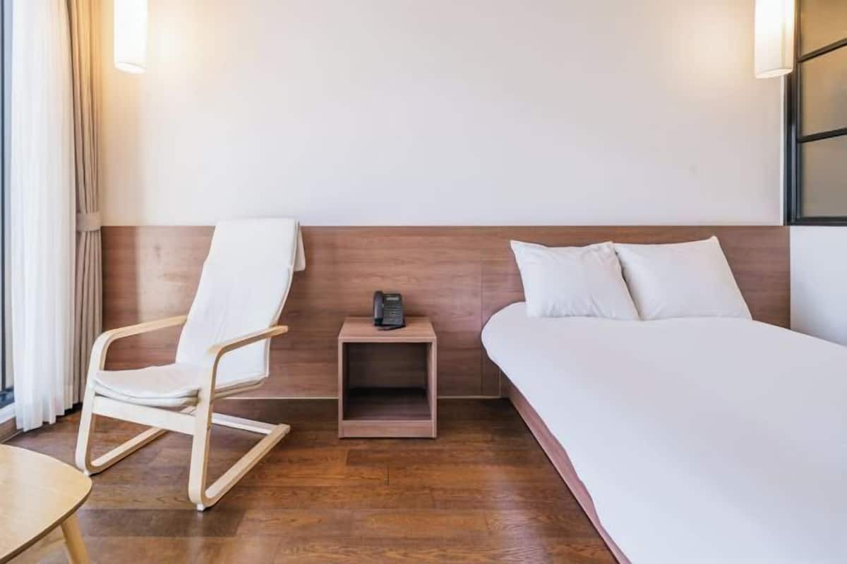 Down comforters, desk, laptop workspace, blackout drapes