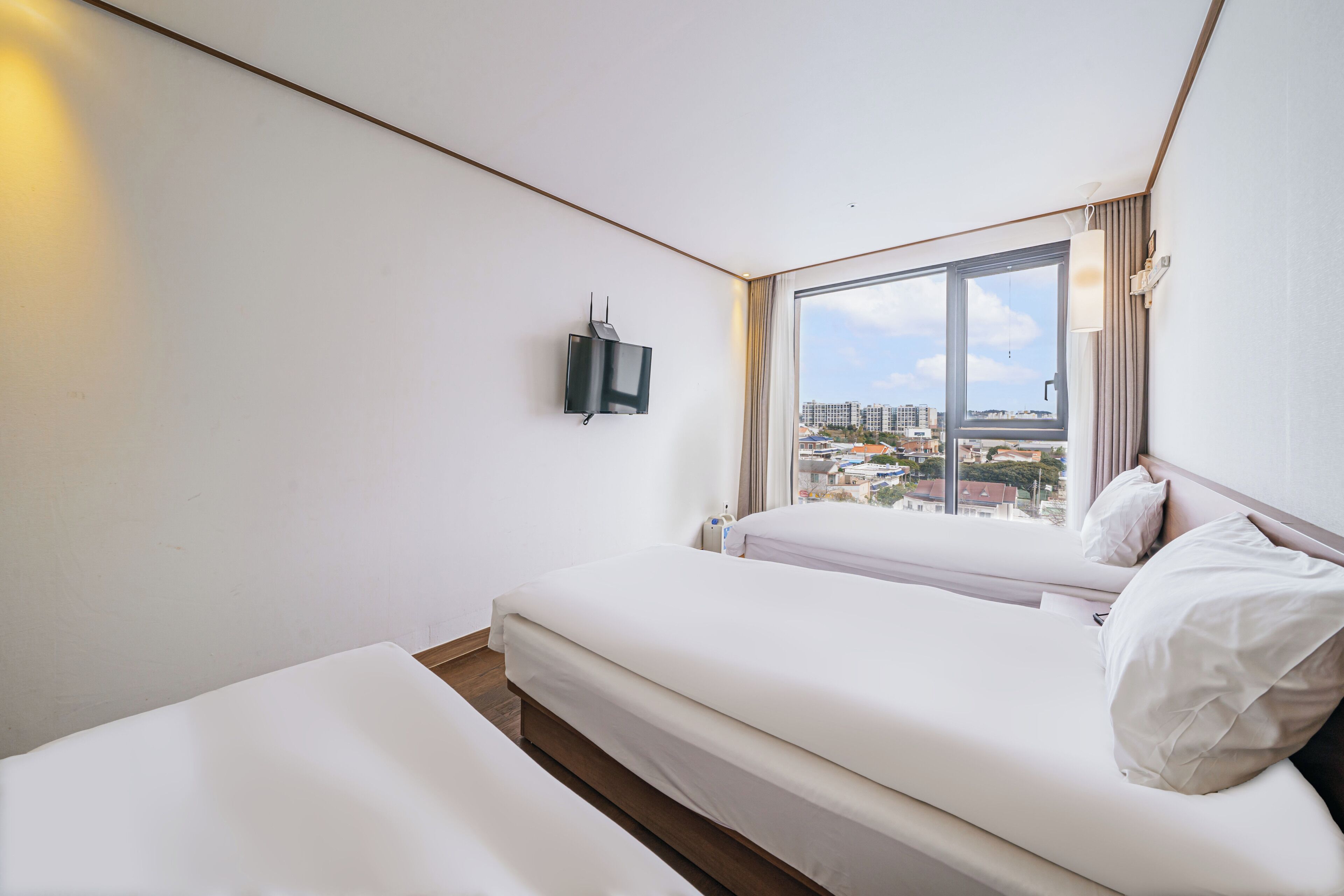 standard triple room, non smoking, ocean view | down duvets, desk, laptop workspace, blackout curtains