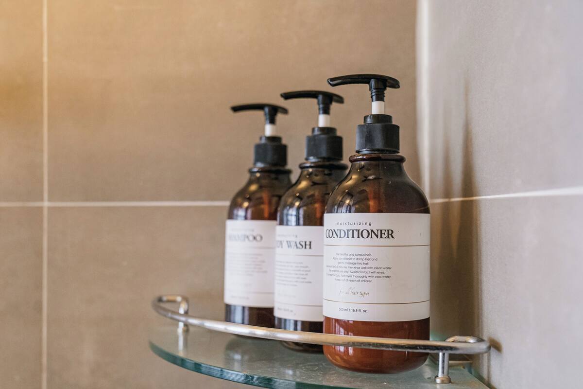 hair dryer, slippers, bidet, towels