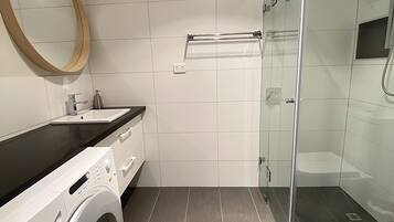 Shower, hair dryer, towels, soap