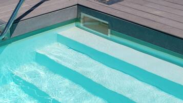 Outdoor pool, open 10:00 AM to 6:00 PM, pool loungers