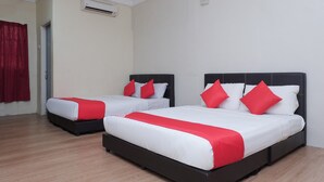A hotel room with two beds, each with white and red bedding, and a red curtain on the left. - Hotel O Kay Inn Kerteh (Kerteh)