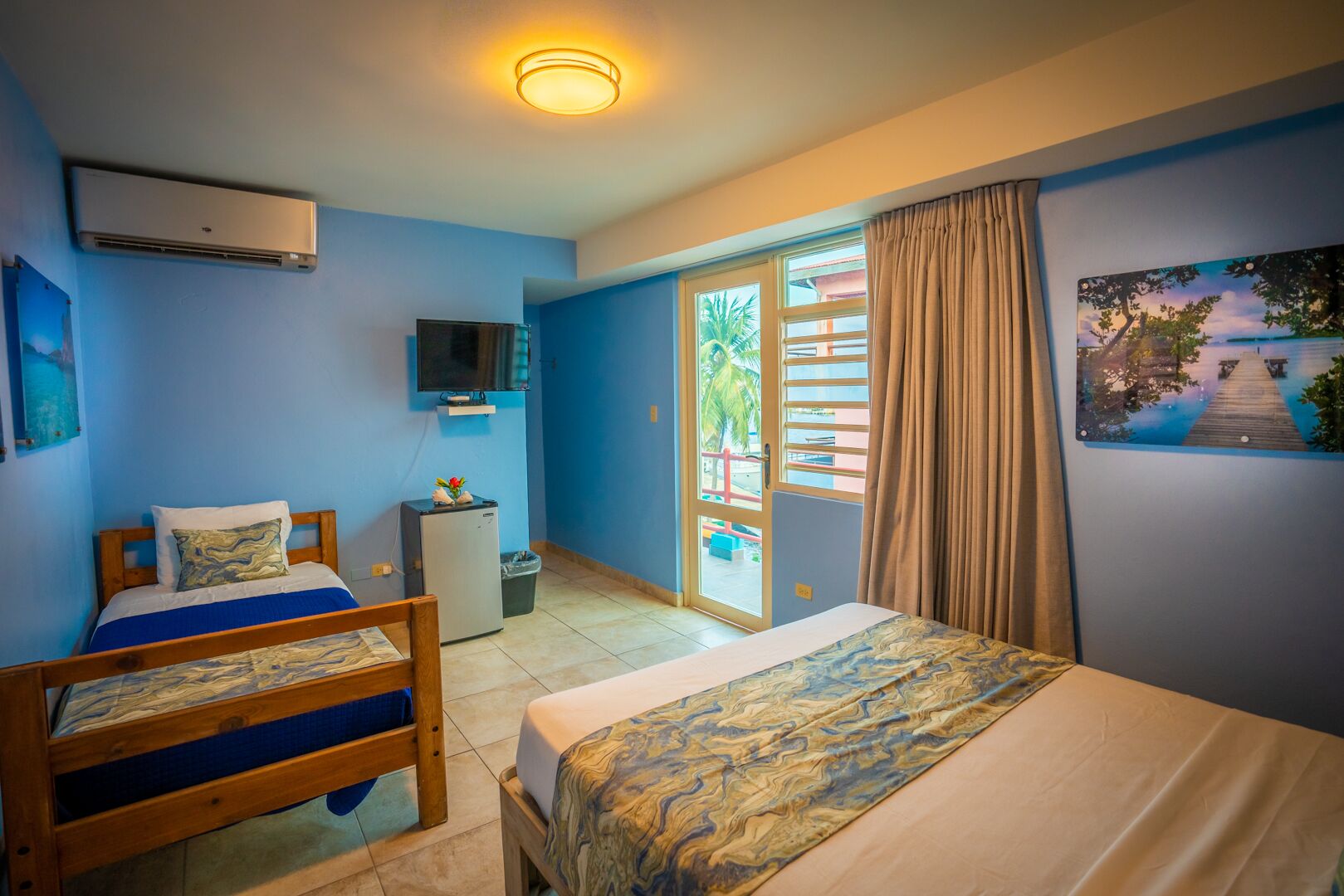 deluxe triple room, partial ocean view | 1 bedroom, minibar, free wifi, bed sheets