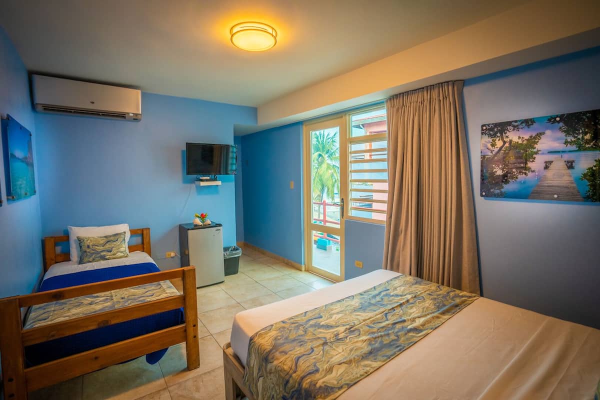 deluxe triple room, partial ocean view | 1 bedroom, minibar, free wifi, bed sheets
