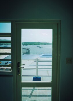 Deluxe Double Room, 1 Queen Bed, Ocean View | 1 bedroom, minibar, free WiFi, bed sheets at El Navegante de Culebra