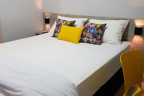Premium bedding, individually furnished, desk, laptop workspace