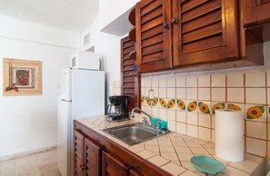 A kitchen with a sink, a coffee maker, and a refrigerator. - Private Terrace & Hammock Near Mamitas Beach (Playa del Carmen, Q.R.)