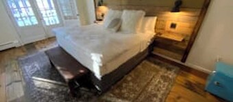 Luxury King Suite, Living Room w/sofa bed, balcony, & 1.5 baths