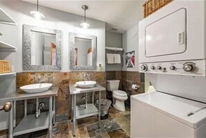 Combined shower/tub, hair dryer, towels, soap
