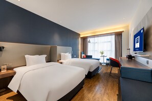 A hotel room with two beds, a desk, a chair, a TV, and a window with curtains. - Holiday Inn Express Changsha Shifu by IHG (Changsha)