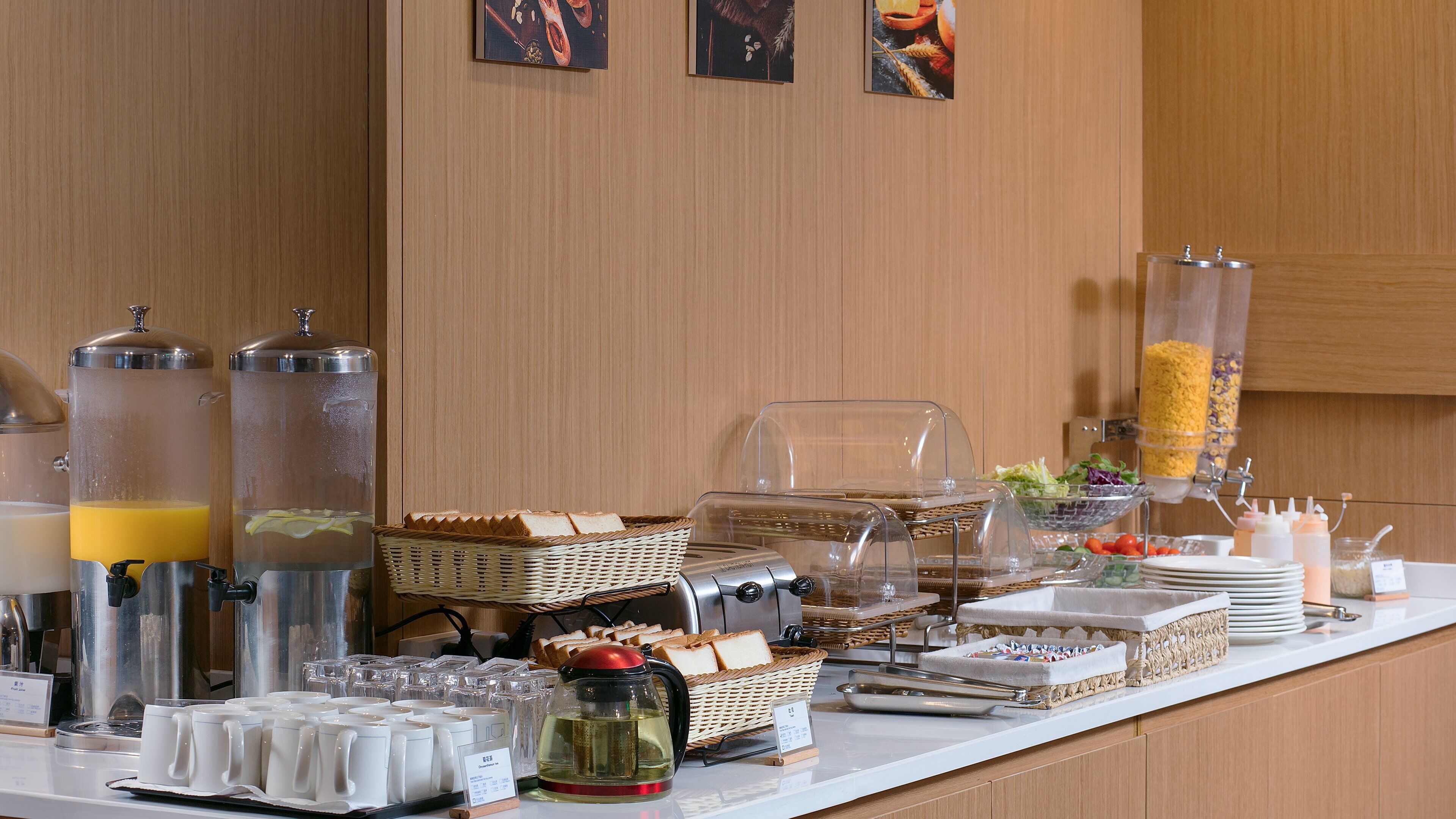 A breakfast buffet with various food items and beverages.