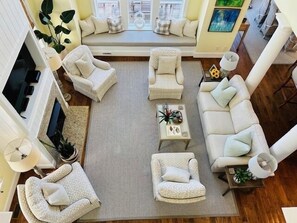 Smart TV, fireplace, books, computer monitors