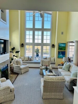 Smart TV, fireplace, books, computer monitors