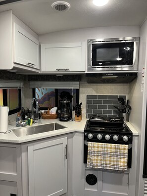 Fridge, microwave, stovetop, coffee/tea maker