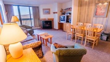 Condo, 1 King Bed (Pinnacle C16) | Living area | Flat-screen TV