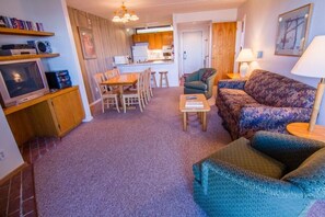 Condo, 1 King Bed (Pinnacle C16) | Living area | Flat-screen TV