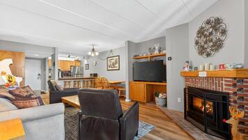 Condo, 1 King Bed with Sofa bed (Pinnacle E08) | Living area | Fireplace